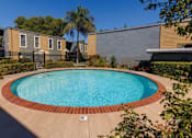 Thumbnail 5 of 7 - A small pool surrounded by a brick border.