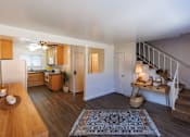 Thumbnail 5 of 11 - the view of a living room with a staircase and a kitchen