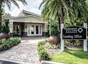 Thumbnail 1 of 10 - The image shows the entrance to the Parkway Square Apartments leasing office.