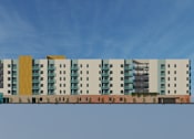 Thumbnail 12 of 14 - A row of modern buildings with a tree in the foreground.