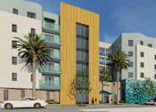 Thumbnail 5 of 14 - A modern building with a yellow door stands out among other buildings.