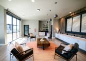 Thumbnail 8 of 47 - a living room with a couch and chairs and a table