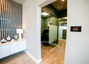 Thumbnail 38 of 47 - a room with a mirror and a desk in a room room rooms