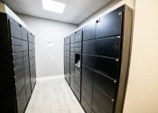Thumbnail 42 of 47 - a set of black lockers in a room with a wooden floor
