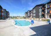 Thumbnail 46 of 47 - our apartments have a resort style pool with lounge chairs