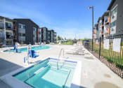 Thumbnail 44 of 47 - the preserve at ballantyne commons pool and apartment building with pools and chairs