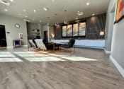 Thumbnail 11 of 47 - a large room with a table and chairs and a fireplace