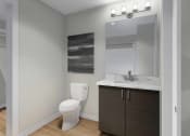 Thumbnail 8 of 11 - a bathroom with a toilet and a sink and a mirror