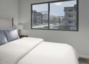 Thumbnail 7 of 11 - a bedroom with a large bed and a window