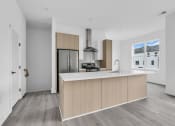 Thumbnail 19 of 63 - A modern kitchen with a wooden island and stainless steel appliances at The Franklin Marlboro Apartments, Marlboro, New Jersey
