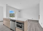 Thumbnail 22 of 63 - A modern kitchen with a stainless steel dishwasher and oven. at The Franklin Marlboro Apartments, New Jersey, 07746