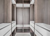 Thumbnail 16 of 63 - A long hallway with a bench on the side and a door at the end. at The Franklin Marlboro Apartments, New Jersey, 07746