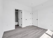 Thumbnail 21 of 63 - an empty room with white walls and doors at The Franklin Marlboro Apartments, Marlboro, NJ