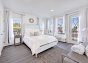 Thumbnail 4 of 11 - a white bedroom with a large bed and windows at The Franklin at Hillsborough Apartments, Hillsborough, New Jersey