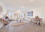 Thumbnail 6 of 11 - a living room with a couch and a table at The Franklin at Hillsborough Apartments, New Jersey