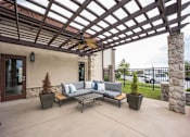 Thumbnail 21 of 22 - the patio has a pergola and couches on it