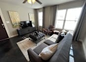 Thumbnail 5 of 22 - a living room with a couch and a tv