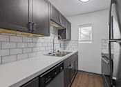Thumbnail 3 of 12 - a kitchen with a sink and a refrigerator