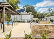 Thumbnail 9 of 11 - the outdoor entertaining area of a home with a pool and a movie screen