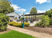 Thumbnail 10 of 11 - a patio with tables and chairs and a pergola