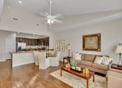 Thumbnail 5 of 14 - a living room with a couch and a table