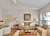 Thumbnail 6 of 14 - a living room with a couch and a coffee table