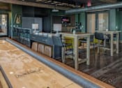 Thumbnail 6 of 35 - a large room with tables and chairs and a bar