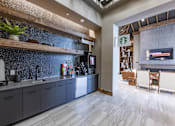 Thumbnail 12 of 35 - a kitchen and dining area in a hotel room