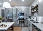 Thumbnail 29 of 35 - a kitchen with white cabinets and stainless steel appliances
