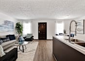 Thumbnail 4 of 18 - a living room with a couch and a sink at The Lorient Apartments, Pensacola, Florida