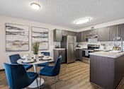 Thumbnail 6 of 18 - our apartments offer a kitchen and dining room with stainless steel appliances at The Lorient Apartments, Pensacola, FL, 32514
