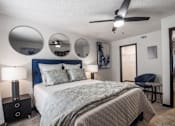 Thumbnail 9 of 18 - a bedroom with a bed and a ceiling fan at The Lorient Apartments, Pensacola