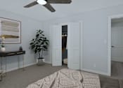 Thumbnail 8 of 16 - a bedroom with two closets and a bed and a ceiling fan