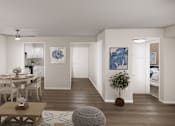 Thumbnail 3 of 6 - A living room with a dining table and chairs.