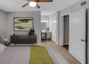 Thumbnail 5 of 9 - A bedroom with a bed, a nightstand, and a painting on the wall.