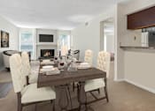 Thumbnail 2 of 5 - A dining room with a wooden table and white chairs.