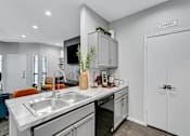 Thumbnail 4 of 20 - a kitchen with a sink and a counter top