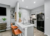 Thumbnail 5 of 20 - a kitchen with a sink and a counter top