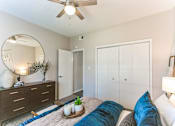 Thumbnail 15 of 20 - a bedroom with a bed and a ceiling fan