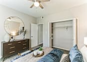 Thumbnail 14 of 20 - a bedroom with a bed and a ceiling fan
