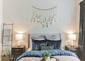 Thumbnail 16 of 20 - a bedroom with a bed and a decoration on the wall