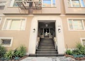 Thumbnail 1 of 59 - the front of a building with stairs and a door