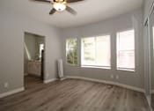 Thumbnail 5 of 59 - a living room with wood floors and a ceiling fan