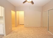 Thumbnail 23 of 59 - a empty bedroom with a ceiling fan and mirrored closet