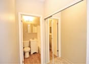 Thumbnail 24 of 59 - a bathroom with a toilet and a mirror