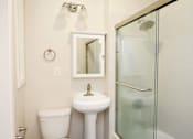Thumbnail 36 of 59 - a bathroom with a toilet sink and a shower