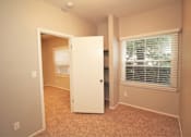 Thumbnail 40 of 59 - a room with a window and a door and a closet