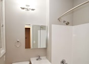 Thumbnail 44 of 59 - a bathroom with a toilet and a tub and a sink