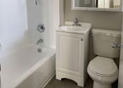 Thumbnail 52 of 59 - a bathroom with a sink toilet and a bath tub