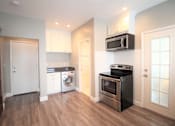 Thumbnail 57 of 59 - a renovated kitchen with stainless steel appliances and white cabinets